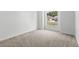 Bright, carpeted bedroom features a large window for natural light at 25830 Crippen Dr, Land O Lakes, FL 34639