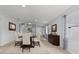 Dining area with modern décor, neutral walls, leading to the kitchen and living room at 25830 Crippen Dr, Land O Lakes, FL 34639