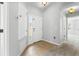 Inviting entryway with tiled flooring, coat closet, and natural light at 25830 Crippen Dr, Land O Lakes, FL 34639