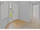 Bright entryway features a neutral color scheme, light tile, and a clear view to the outdoors at 25830 Crippen Dr, Land O Lakes, FL 34639