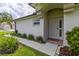 Inviting front entrance featuring a well-maintained garden and a charming 'Home Sweet Home' doormat at 25830 Crippen Dr, Land O Lakes, FL 34639