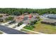 An elevated view of a single Gathering home featuring manicured landscaping and an attached two car garage at 25830 Crippen Dr, Land O Lakes, FL 34639