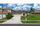 Charming single-story home with lush front lawn and long driveway with attached garage at 25830 Crippen Dr, Land O Lakes, FL 34639