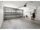 Clean, empty garage with a sectional door and garage door opener at 25830 Crippen Dr, Land O Lakes, FL 34639