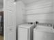 Laundry room with side-by-side washer and dryer and wire shelving at 25830 Crippen Dr, Land O Lakes, FL 34639