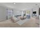 Bright and airy living room with plush furniture, neutral walls, and ample natural light at 25830 Crippen Dr, Land O Lakes, FL 34639