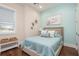 Comfortable bedroom with a nautical aesthetic and plenty of natural light at 20 Outlook Way Blvd # 7, Dunedin, FL 34698