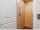 Interior elevator with light wood walls at 265 Causeway Blvd # 7, Dunedin, FL 34698