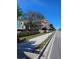 Street view of new construction beach homes with attached garages, balconies, and landscaping at 20 Outlook Way Blvd # 7, Dunedin, FL 34698
