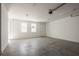 Spacious garage with windows and access door at 20 Outlook Way Blvd # 7, Dunedin, FL 34698
