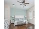 Serene main bedroom suite featuring calming wall colors, a plush queen bed, and an abundance of natural light at 20 Outlook Way Blvd # 7, Dunedin, FL 34698