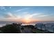 Sunset view over the ocean next to beach homes at 20 Outlook Way Blvd # 7, Dunedin, FL 34698