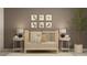 Cozy Bedroom featuring a wood crib, neutral decor, and cute animal wall art at 2670 Buttercup Lucine Ln, Ruskin, FL 33570