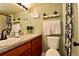 Cozy bathroom with a dark wood vanity, plenty of light and a shower and tub at 2700 Cove Cay Dr # 2B, Clearwater, FL 33760