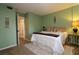 The main bedroom features a neutral color palette and large bed at 2700 Cove Cay Dr # 2B, Clearwater, FL 33760