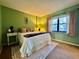 Comfortable bedroom with a queen bed, area rug, and sunny window at 2700 Cove Cay Dr # 2B, Clearwater, FL 33760