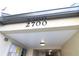 Close-up of the entrance to the condo building with clear signage at 2700 Cove Cay Dr # 2B, Clearwater, FL 33760