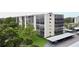 Condo building featuring well-maintained landscaping, covered parking, and a desirable residential setting at 2700 Cove Cay Dr # 2B, Clearwater, FL 33760
