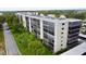 Wide angle view of a multi-story condo building featuring expansive windows and covered parking at 2700 Cove Cay Dr # 2B, Clearwater, FL 33760