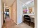 Hallway with a vanity and mirror and chair with access to other rooms in the house at 2700 Cove Cay Dr # 2B, Clearwater, FL 33760