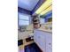 Well-lit bathroom with tiled walls, large mirror, and vanity providing a clean and functional space at 2800 54Th N St, St Petersburg, FL 33710