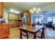 Open-concept dining area connecting to the kitchen, featuring hardwood floors and natural light at 2800 54Th N St, St Petersburg, FL 33710