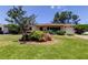 Charming home featuring a lush green lawn and mature landscaping, creating inviting curb appeal at 2800 54Th N St, St Petersburg, FL 33710