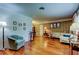 Spacious living room featuring hardwood floors, vintage wallpaper, and comfortable seating at 2800 54Th N St, St Petersburg, FL 33710