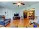 Open-concept living room with wood floors, comfortable seating, and bright natural light at 2800 54Th N St, St Petersburg, FL 33710