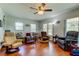Comfortable living room with hard flooring and ceiling fan providing a relaxing and inviting space at 2800 54Th N St, St Petersburg, FL 33710