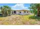View of the backyard with a view of the rear of the house at 2810 9Th St, Englewood, FL 34224