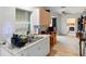 Kitchen featuring granite countertops, white cabinets, and modern appliances at 2810 9Th St, Englewood, FL 34224