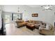 Comfortable living area featuring tile floors, vaulted ceilings, and neutral walls at 2810 9Th St, Englewood, FL 34224