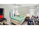 Bright main bedroom featuring tile flooring, ceiling fan, and closet at 2810 9Th St, Englewood, FL 34224