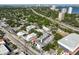 An aerial view of a modern neighborhood with mature trees near a highway and bay at 3012 W Barcelona St # 7, Tampa, FL 33629