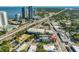 An aerial view of a neighborhood featuring a modern home and commercial buildings near the bay at 3012 W Barcelona St # 7, Tampa, FL 33629