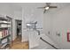 Bright hallway with wooden floors, black handrail, and multiple ceiling fans at 3012 W Barcelona St # 7, Tampa, FL 33629