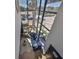 Bright living room featuring floor-to-ceiling windows, a blue sofa, and modern decor at 3012 W Barcelona St # 7, Tampa, FL 33629