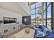 Bright living room with high ceilings, large windows, and modern decor at 3012 W Barcelona St # 7, Tampa, FL 33629