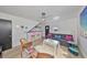 Cozy living room with hardwood floors, modern furniture, and a mini-bar area at 3012 W Barcelona St # 7, Tampa, FL 33629