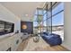Light-filled living room featuring soaring windows, stylish furniture, and modern accents at 3012 W Barcelona St # 7, Tampa, FL 33629