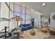 Bright living room with large windows, hardwood floors, and modern coastal-inspired decor, showcasing a comfortable and stylish space at 3012 W Barcelona St # 7, Tampa, FL 33629