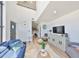 Bright, modern living room with a white brick accent wall, stylish furniture, and a high ceiling for an airy feel at 3012 W Barcelona St # 7, Tampa, FL 33629