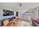 Open living space with hardwood floors, modern furnishings, and a bar area with seating at 3012 W Barcelona St # 7, Tampa, FL 33629