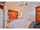 Modern bedroom with built-in wooden closets, a sleek desk, and contemporary decor at 3012 W Barcelona St # 7, Tampa, FL 33629