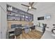 Home office with gray built-ins, spacious work area, and light wood floors at 3012 W Barcelona St # 7, Tampa, FL 33629