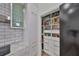 Well-organized pantry with ample storage, featuring custom shelving, drawers, and easy access to kitchen essentials at 3012 W Barcelona St # 7, Tampa, FL 33629