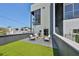 Trendy patio features modern seating and artificial turf at 3012 W Barcelona St # 7, Tampa, FL 33629