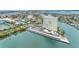 Stunning aerial view of waterfront condo building with marina and covered parking at 31 Island Way # 1507, Clearwater Beach, FL 33767