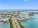 Aerial shot showcasing the building, surrounding roadways, and waterways under a clear blue sky, highlighting its location at 31 Island Way # 1507, Clearwater Beach, FL 33767